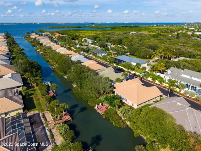 an aerial view of beach residential house with swimming pool and outdoor space
