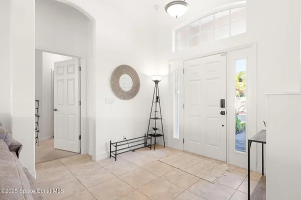 a view of a livingroom with wooden floor and white walls
