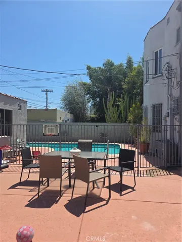 a patio with table and chairs