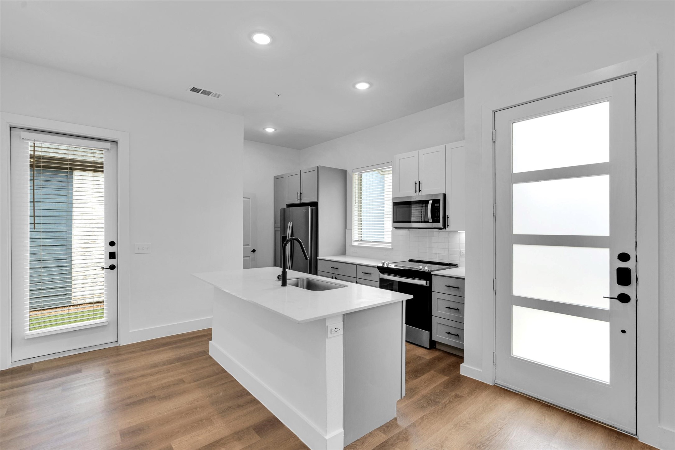1584-326 Bernard Street Rowlett, TX 75089 - Photo 5 of 31 a kitchen with stainless steel appliances a sink stove and refrigerator