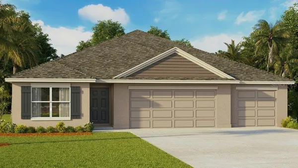 a front view of a house with a garden and yard