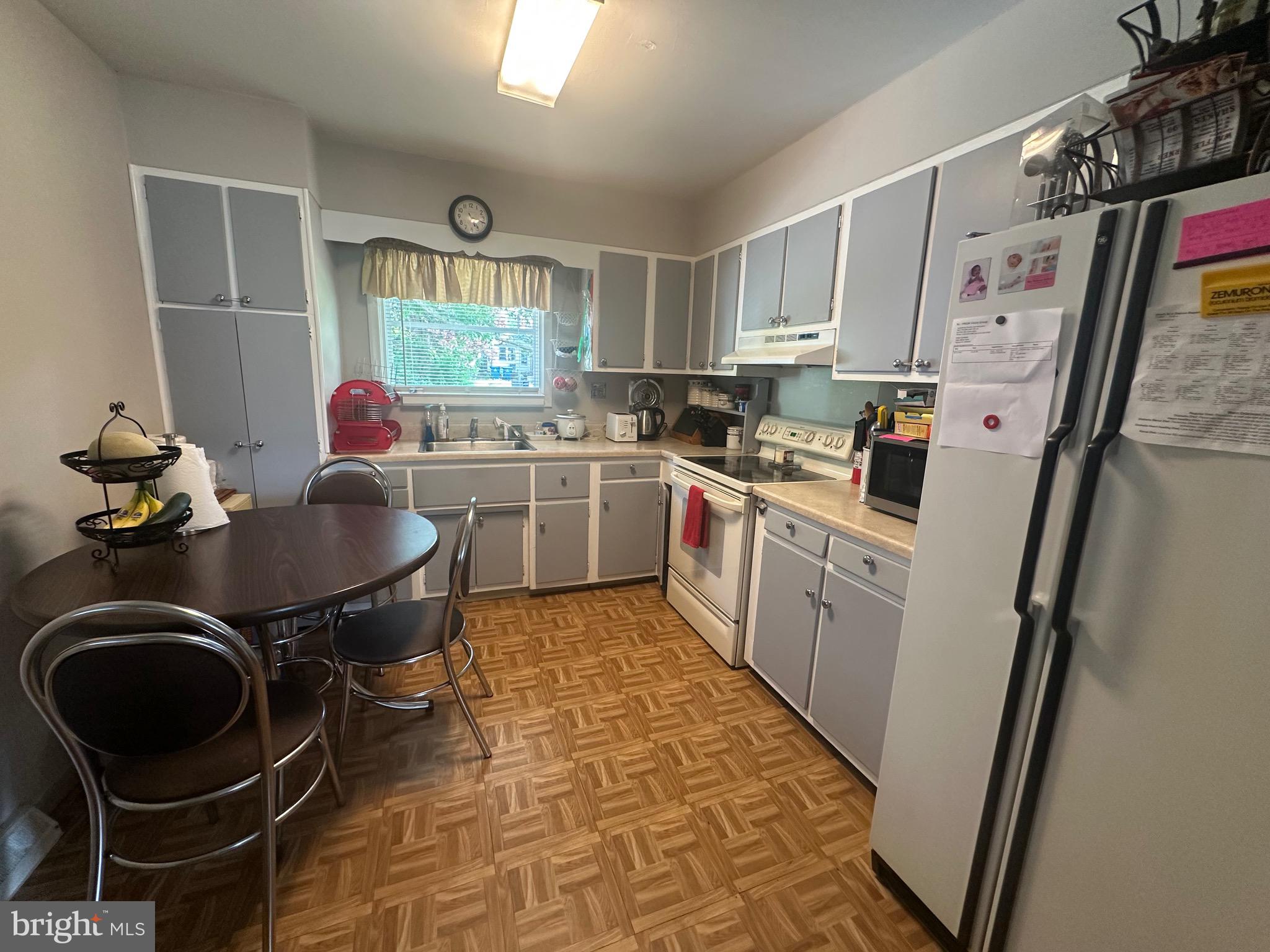 112 Mitchell Street Elkton, MD 21921 - Photo 2 of 5 a kitchen with a sink appliances and cabinets