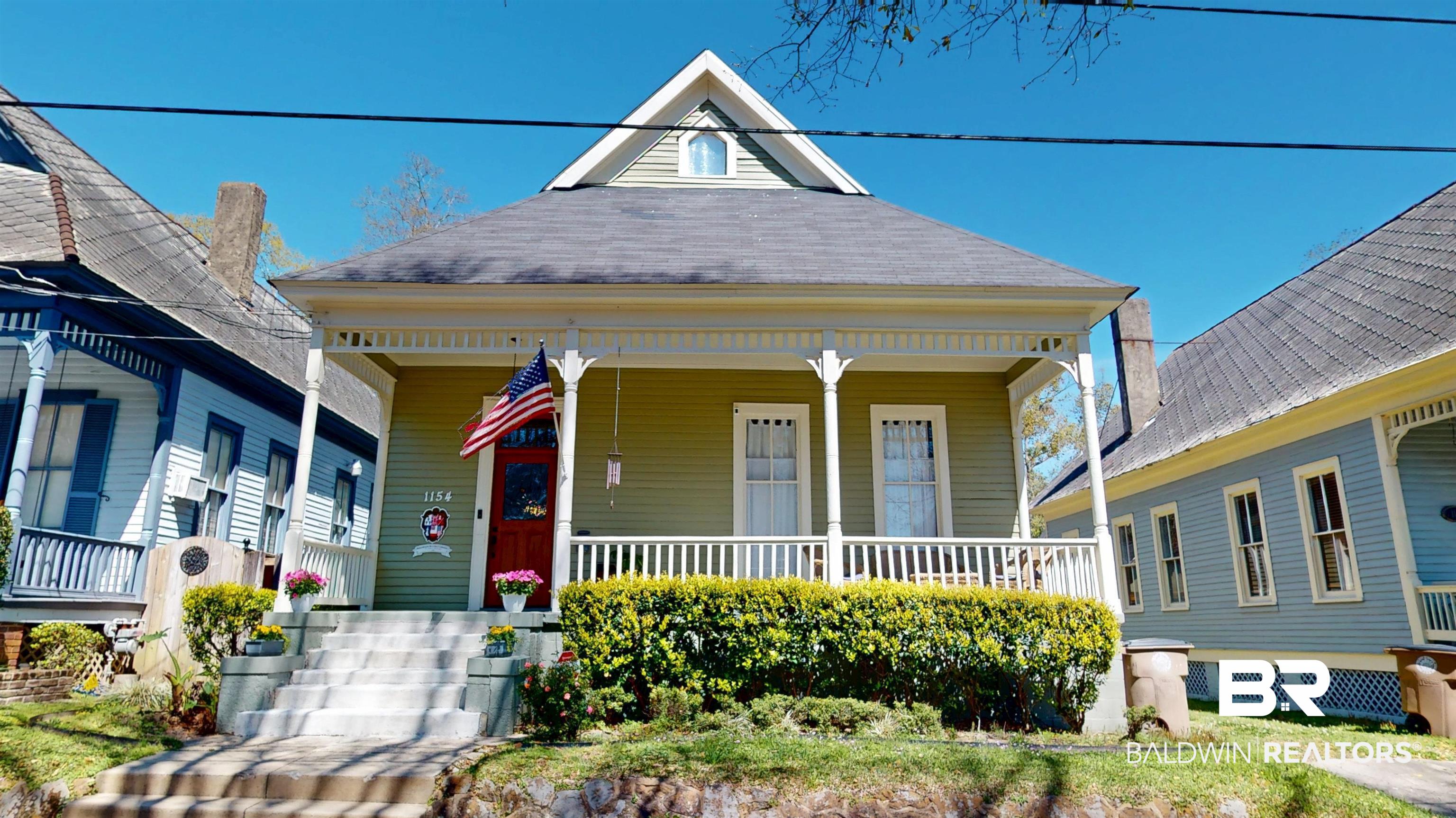1154 New St Francis Street Mobile, AL 36604 - Photo 2 of 37 View of front of property with covered porch and a shingled roof