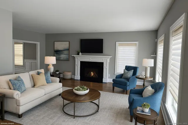 a living room with furniture and a fireplace