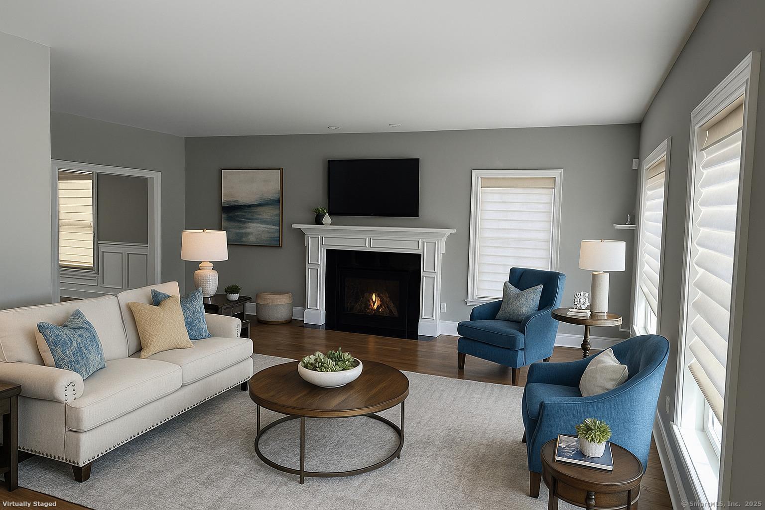 17 Vermont Avenue, Unit 17 Fairfield, CT 06824 - Photo 4 of 16 a living room with furniture and a fireplace