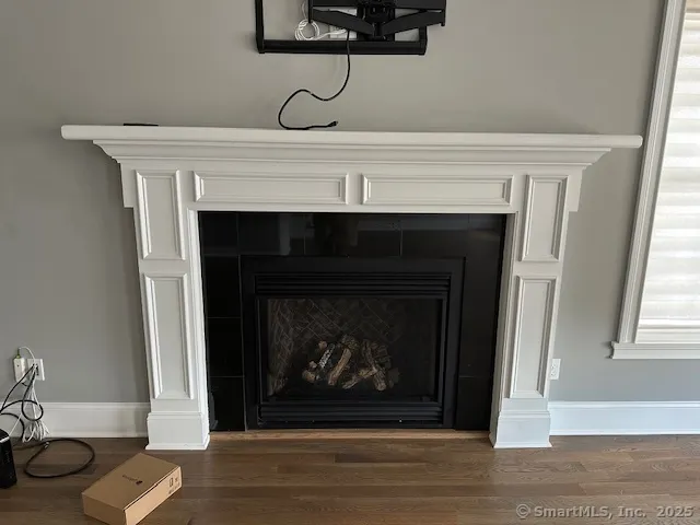 a living room with a fireplace and a fireplace