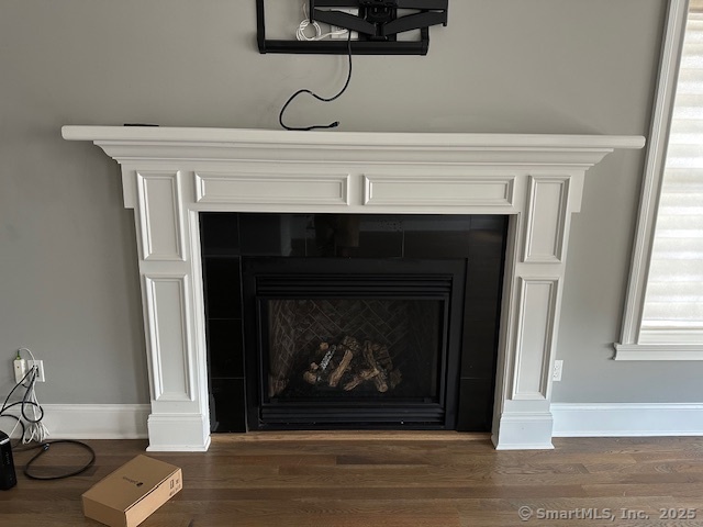17 Vermont Avenue, Unit 17 Fairfield, CT 06824 - Photo 5 of 16 a living room with a fireplace and a fireplace