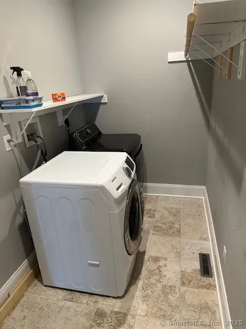 a utility room with dryer and washer