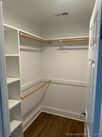 a view of an empty walk in closet