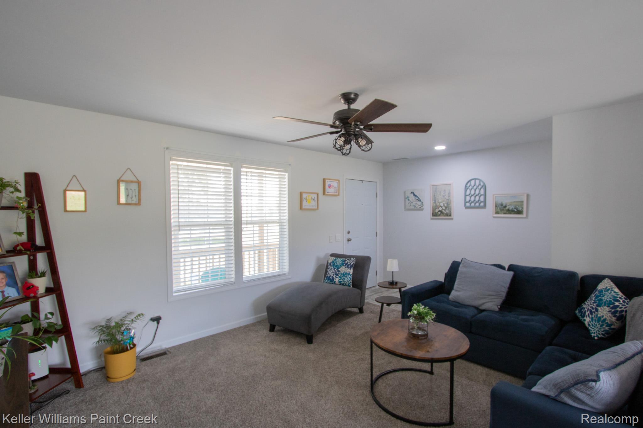 5200 Babcock Road Lexington, MI 48450 - Photo 6 of 31 Spacious living area featuring light gray walls and plush carpeting