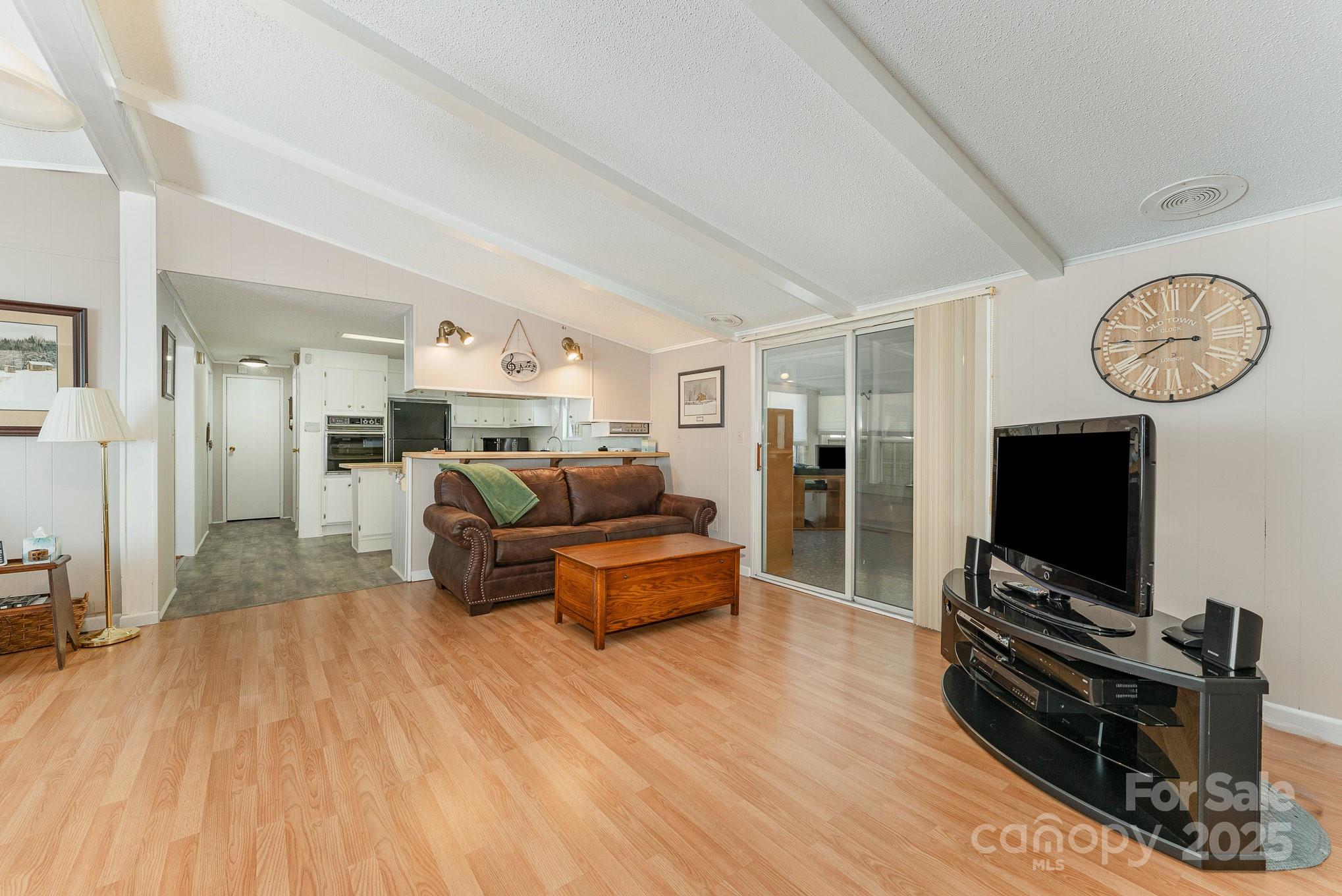 5013 Friendship Circle Road East Bend, NC 27018 - Photo 11 of 31 a living room with furniture and a flat screen tv
