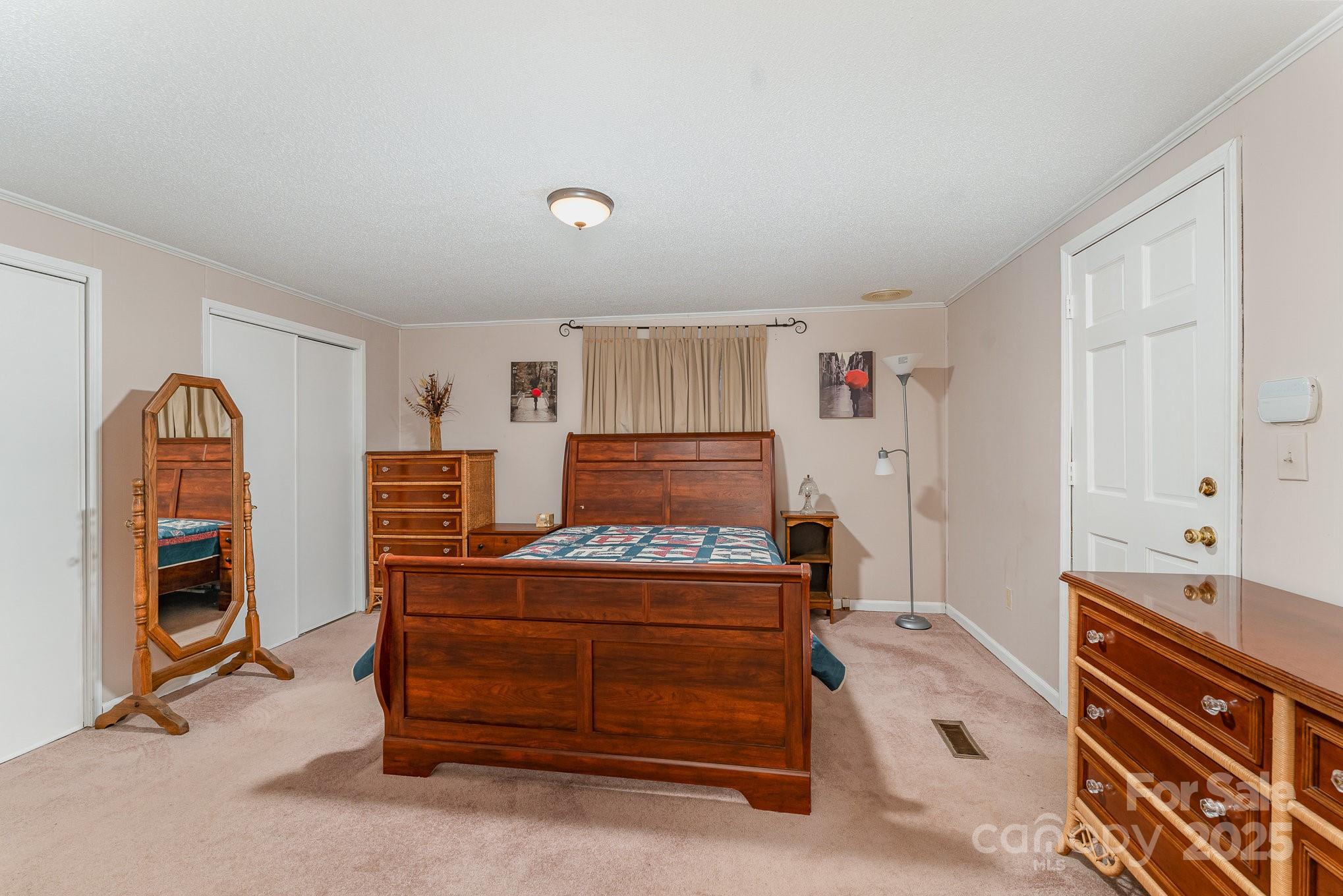 5013 Friendship Circle Road East Bend, NC 27018 - Photo 15 of 31 a bedroom with a bed and a dresser