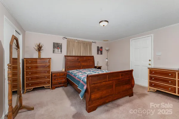 a bedroom with a bed and a closet