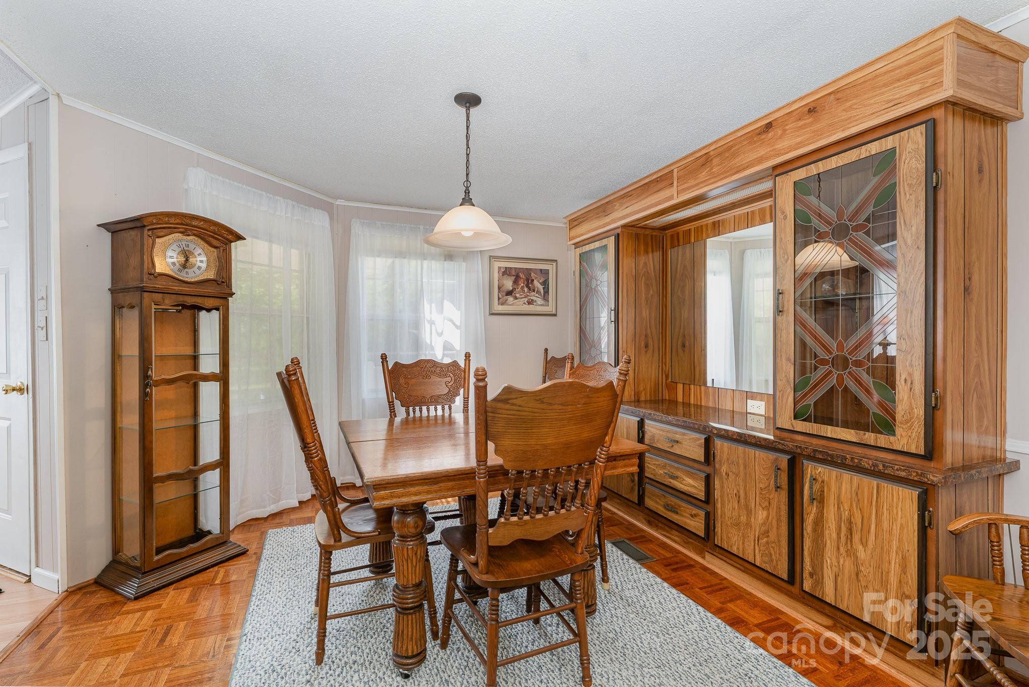 5013 Friendship Circle Road East Bend, NC 27018 - Photo 20 of 31 a view of a dining room with furniture window and wooden floor