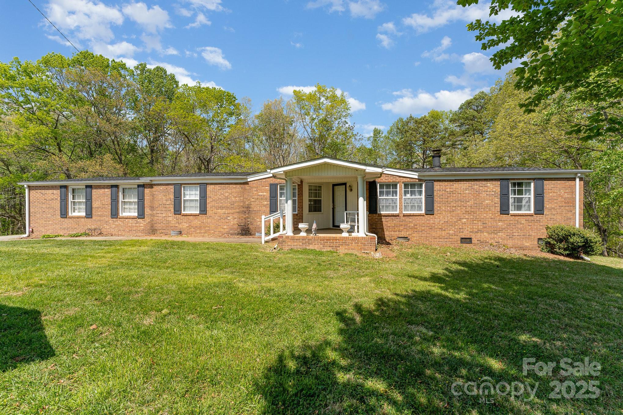 5013 Friendship Circle Road East Bend, NC 27018 - Photo 2 of 31 a front view of a house with a garden