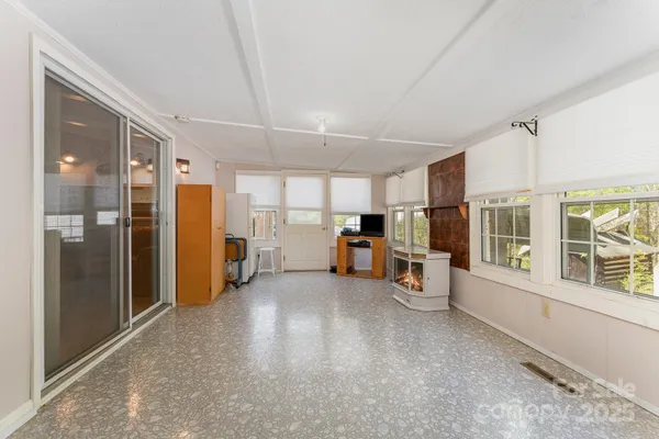 a view of a living room hardwood and windows