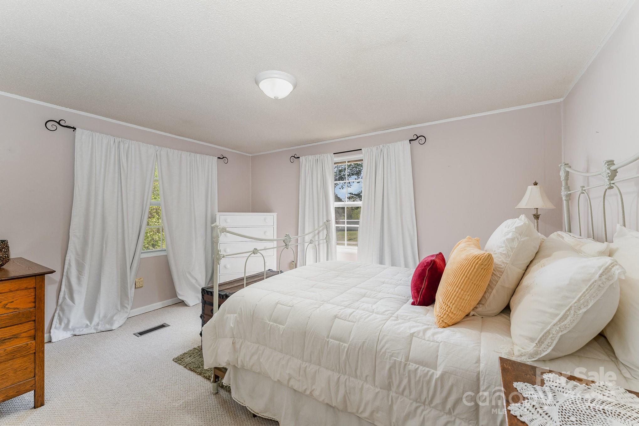 5013 Friendship Circle Road East Bend, NC 27018 - Photo 25 of 31 a bedroom with a bed and a window