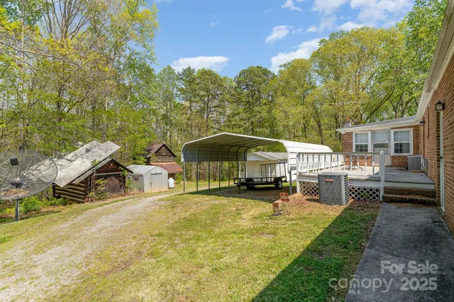 a view of a house with backyard patio and sitting area