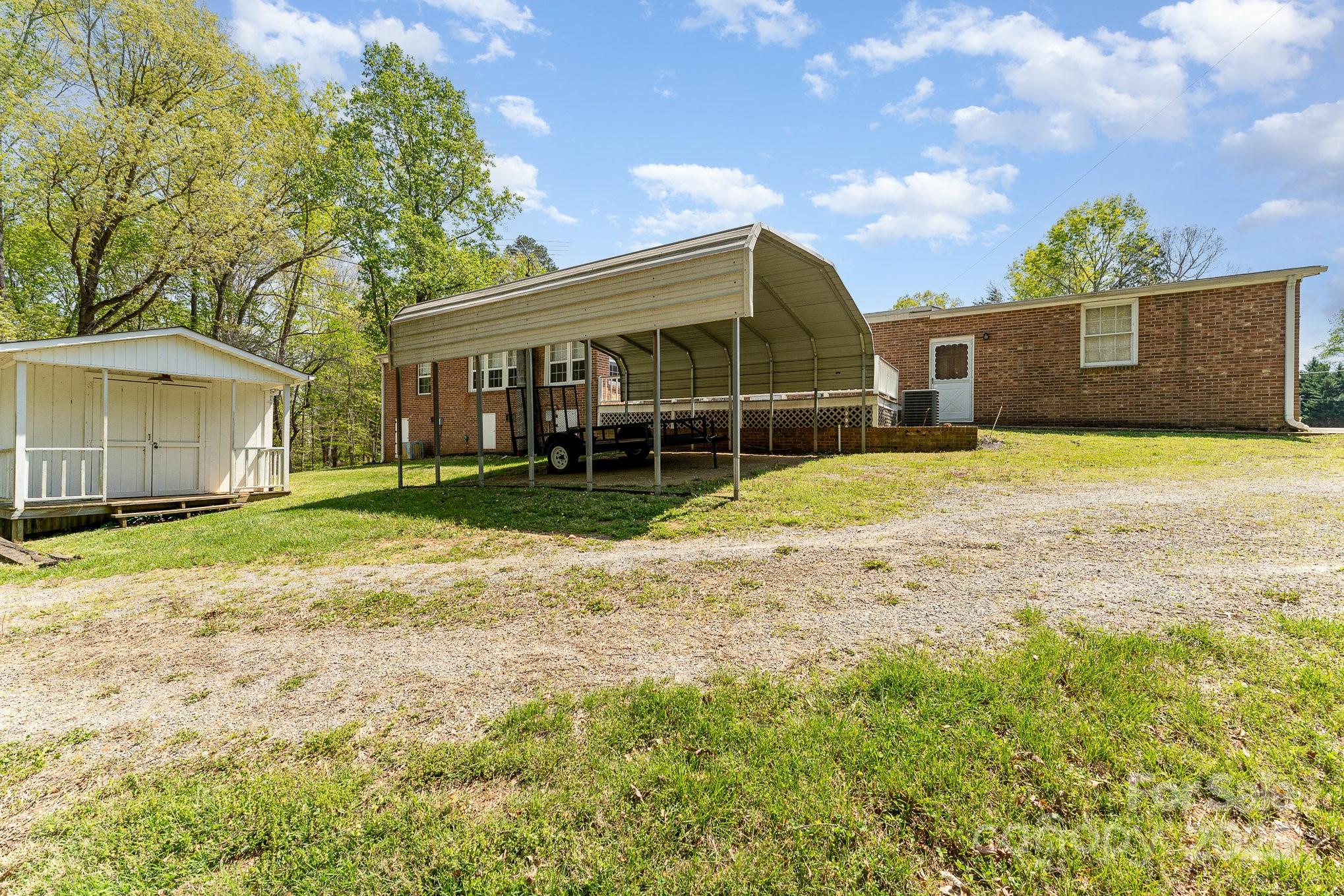 5013 Friendship Circle Road East Bend, NC 27018 - Photo 28 of 31 a view of a house with backyard and trees