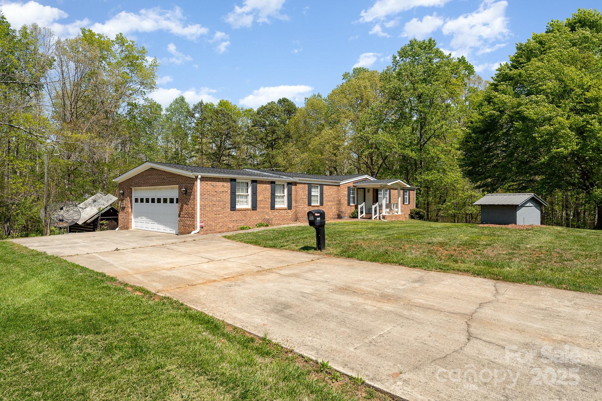 5013 Friendship Circle Road East Bend, NC 27018 - Photo 7 of 31 a front view of a house with a yard and trees