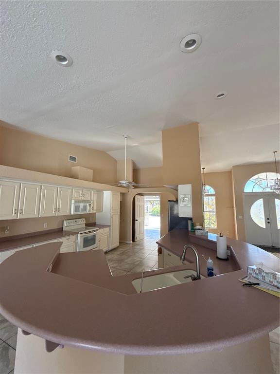 29310 Bryan Way Punta Gorda, FL 33982 - Photo 11 of 30 a view of a living room and kitchen