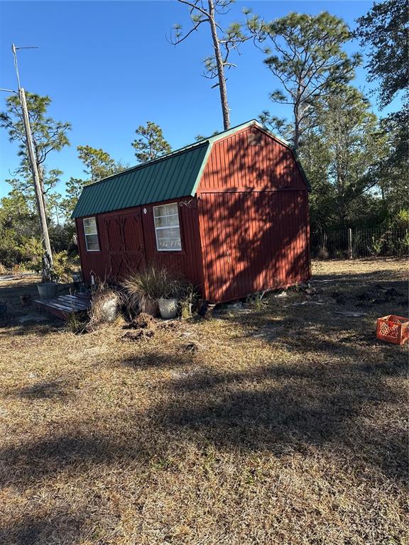29310 Bryan Way Punta Gorda, FL 33982 - Photo 24 of 30 a front view of a house with garden