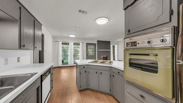 a kitchen with a sink stove and refrigerator