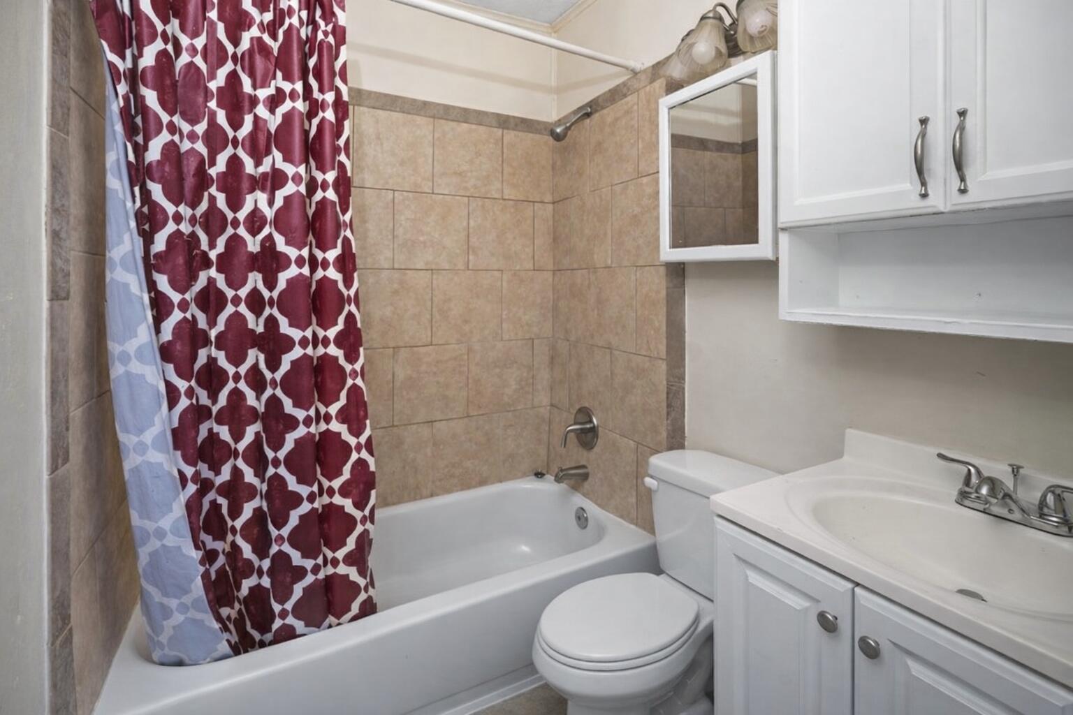 2018 Chester Avenue Augusta, GA 30906 - Photo 12 of 17 Standard bathroom with beige tiles and f