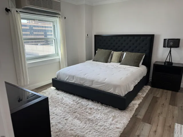 a bathroom with a sink and mirror with toilet