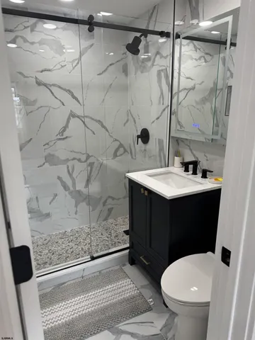 a kitchen with stainless steel appliances a sink stove and cabinets
