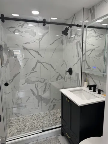 a kitchen with stainless steel appliances a sink stove and refrigerator