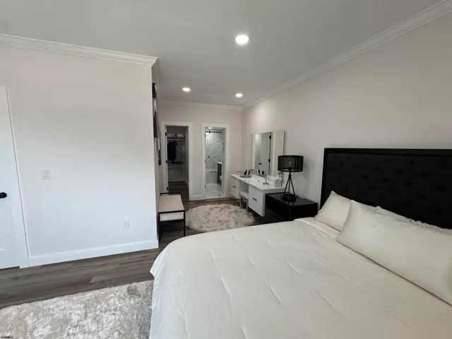 a bedroom with furniture and a window