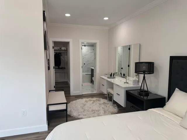 a view of a room with a table and chairs