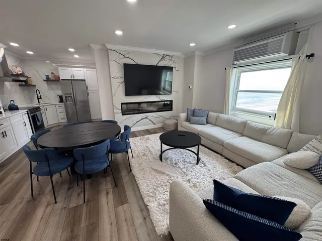 a large bed sitting in a bedroom next to a window