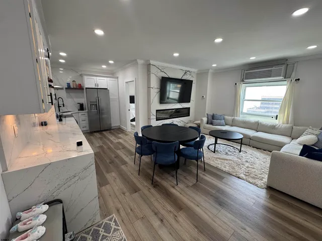a bathroom with a sink vanity granite and shower