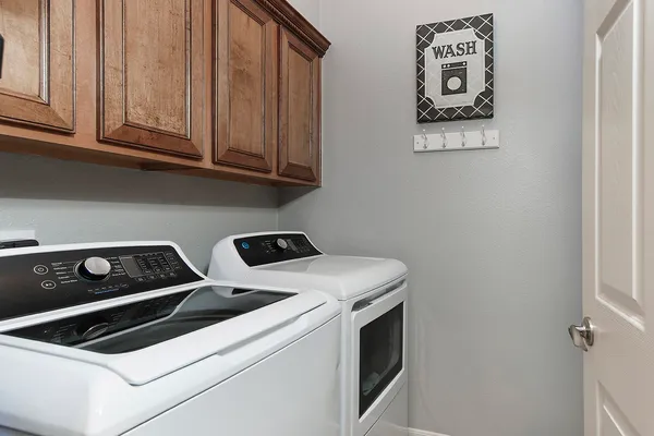 a utility room with dryer and washer