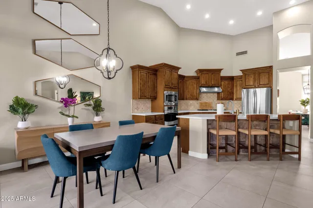 a kitchen with stainless steel appliances granite countertop a sink stove and microwave