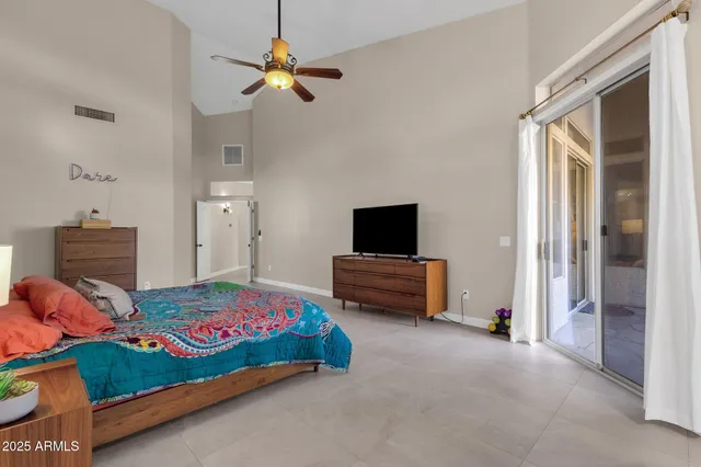 a spacious bathroom with a granite countertop sink a mirror and shower