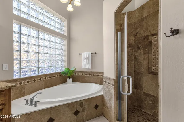 a view of a swimming pool with outdoor seating