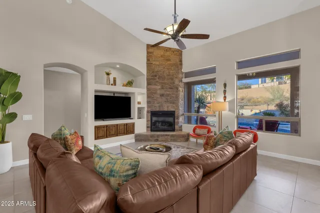 a kitchen with stainless steel appliances a table chairs and a refrigerator