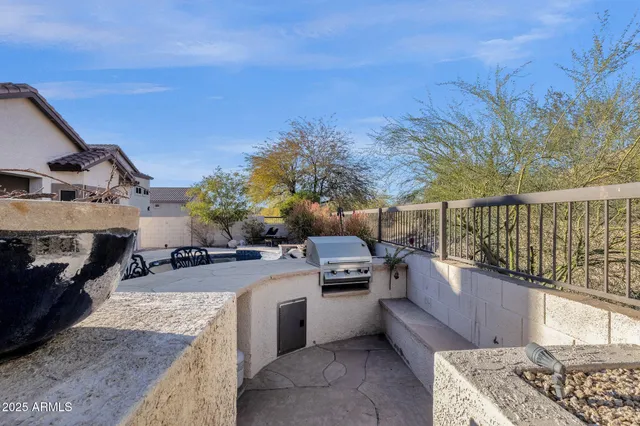 a view of a swimming pool with sitting area