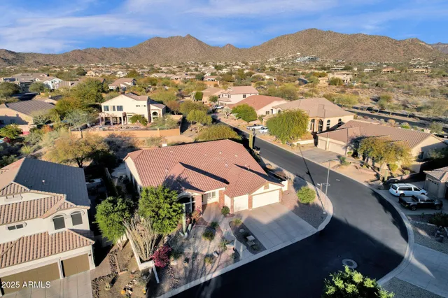 an aerial view of residential houses with outdoor space