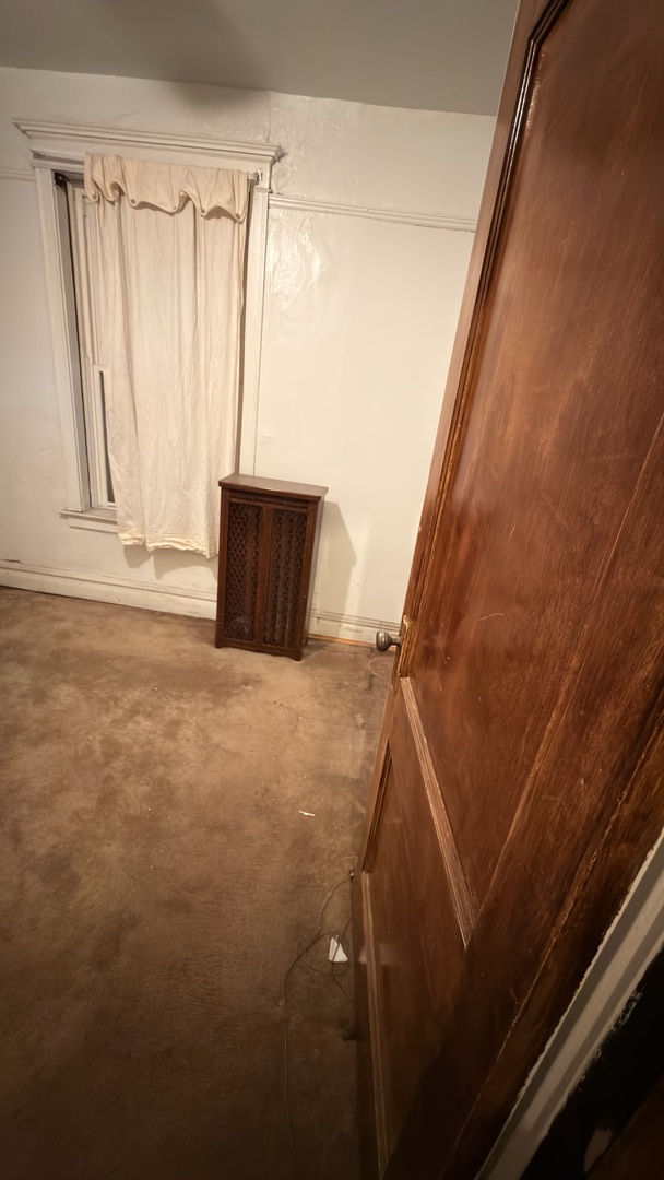 5134 South Indiana Avenue Chicago, IL 60615 - Photo 4 of 4 a view of walk in closet with clothes