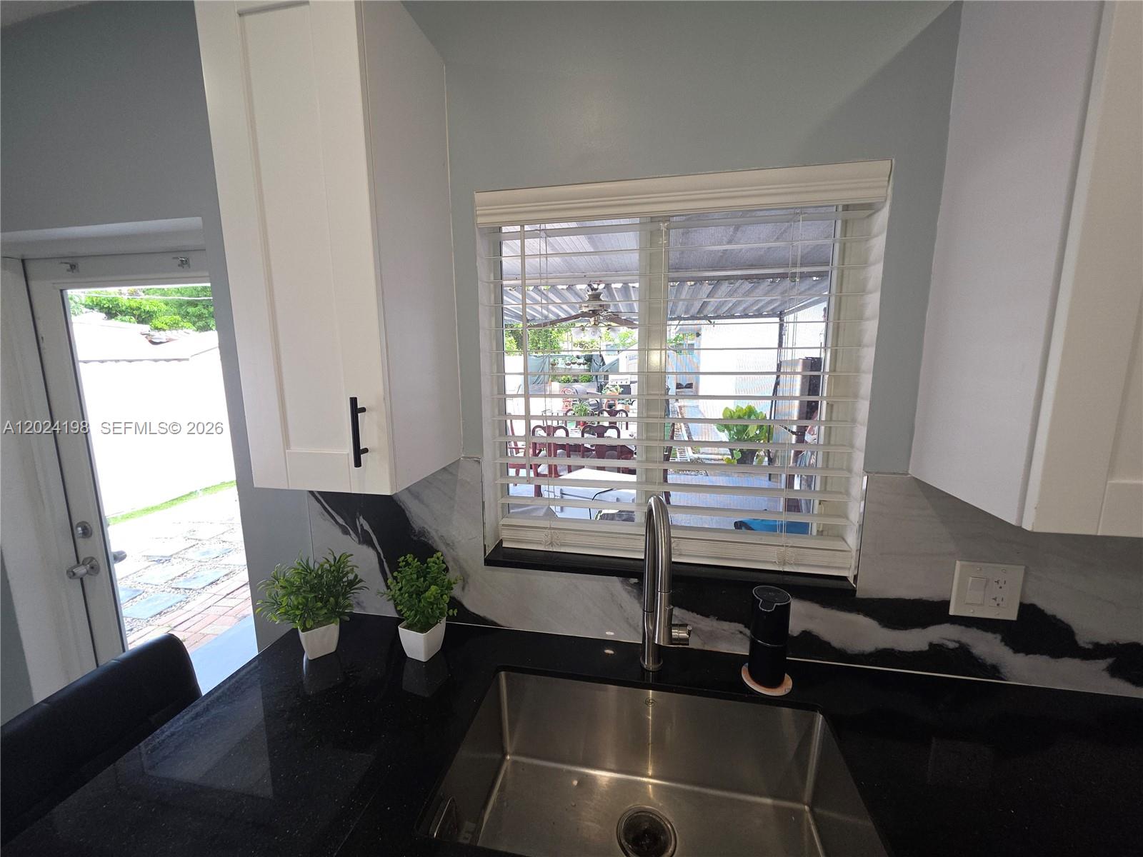 651 East 48th Street Hialeah, FL 33013 - Photo 19 of 52 a room with furniture and window