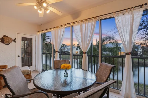 a view of a dining room with furniture window and outside view