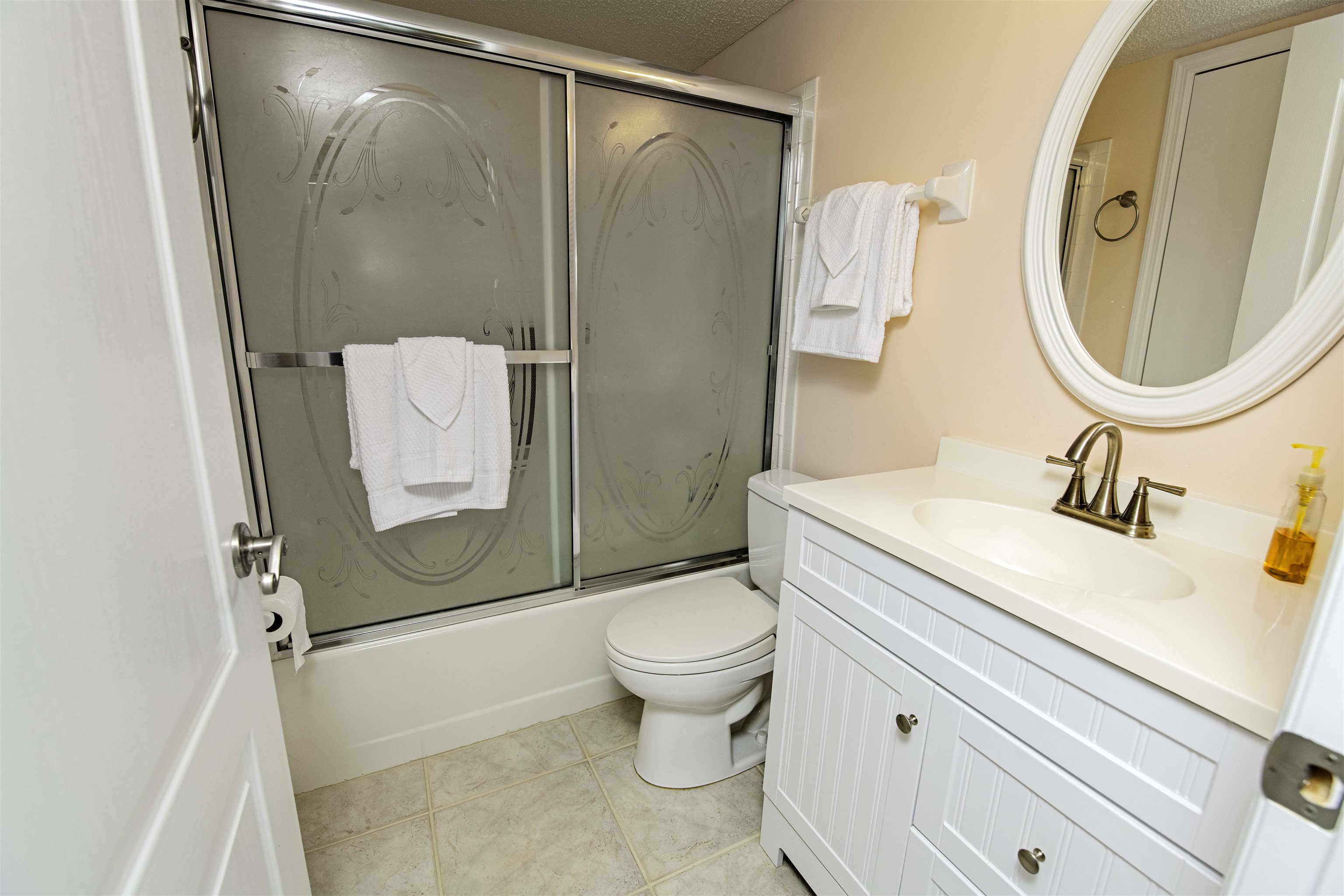880 A1A Beach Boulevard, Unit 7302 St. Augustine, FL 32080 - Photo 15 of 28 a bathroom with a granite countertop sink toilet and shower