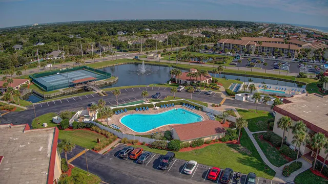 an aerial view of a house with outdoor space