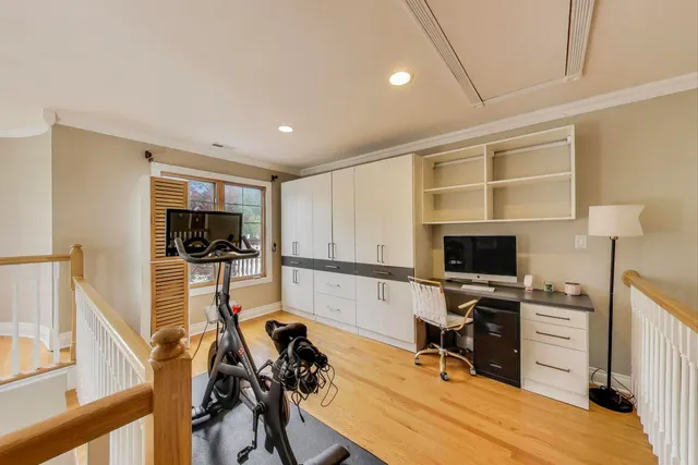 a view of a bedroom with furniture window and a chandelier