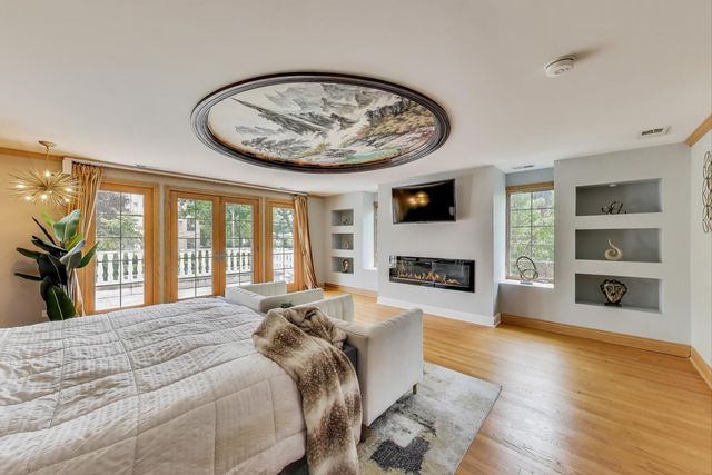 a view of a balcony with wooden floor and city view