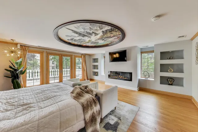 a view of a balcony with wooden floor and city view